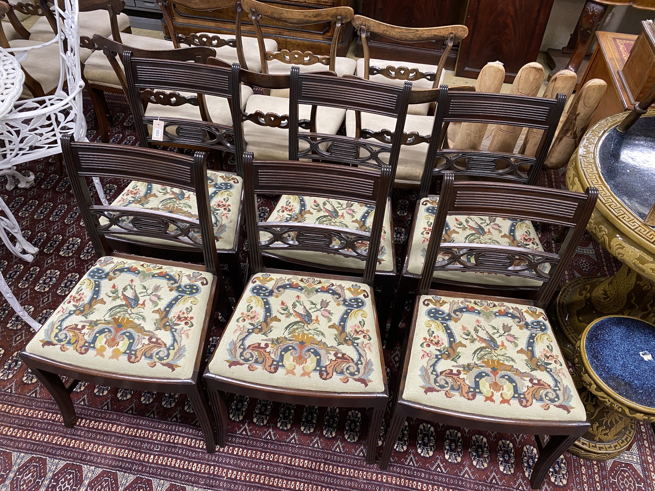 A set of six George IV mahogany dining chairs with tapestry drop in seats, height 85cm